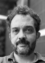 Black and white portrait of Chris Feliciano Arnold