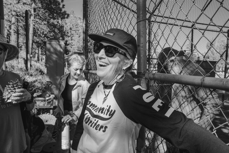 A poet plays softball at the 2026 Poetry Program of the Community of Writers. Photo by Nic Nichols nicholasnichols.com @maruneboy